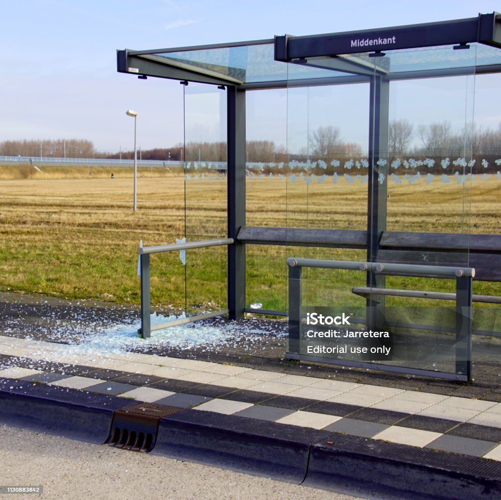 Vandalised bus shelter n the city of Almere. Almere Poort, the Netherlands - February 20, 2019: Vandalised bus shelter n the city of Almere. Bus Shelter Stock Photo