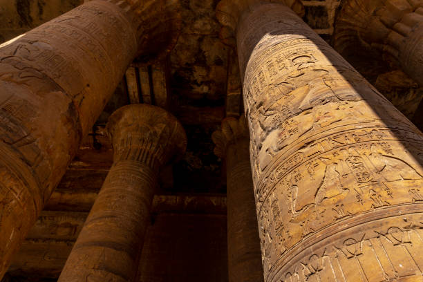 Unravel the mysteries of ancient Egypt with the Hieroglyphs inside the Temple of Ramses in Abu Simbel, Egypt, by the Nile. Decipher the stories of pharaohs.