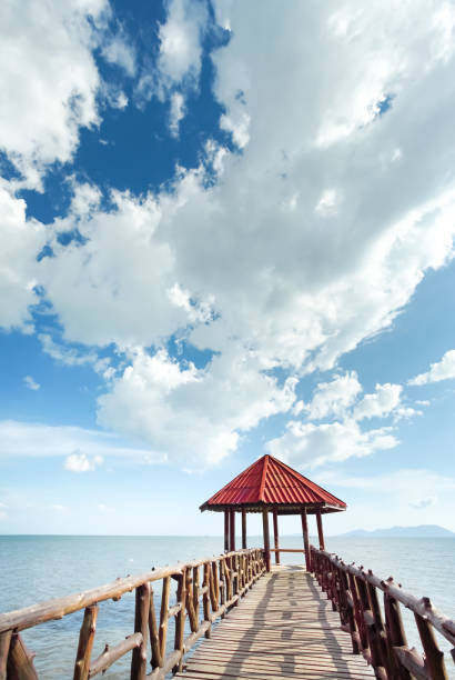 istock Little pavilion in the sea cloudy background. 1130884566