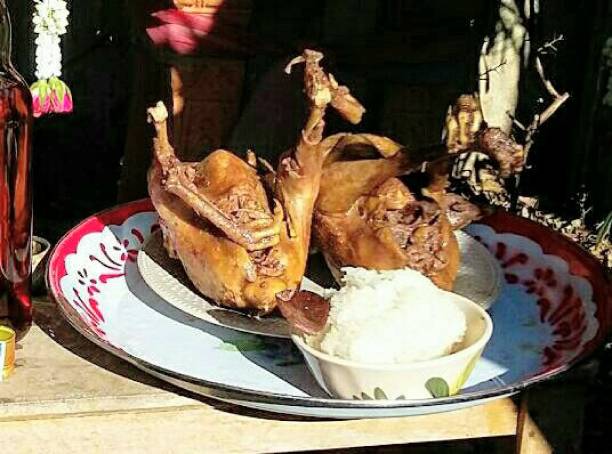 istock Roasted Chicken - Thai kitchen - whole chicken with head 1130884629