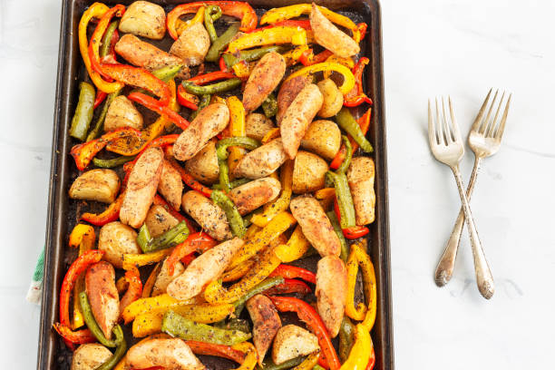 istock Italian Sausage and Peppers on Baking Sheet Horizontal Photo 1130884928