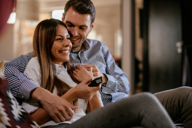 istock Couple at home watching TV 1130885994