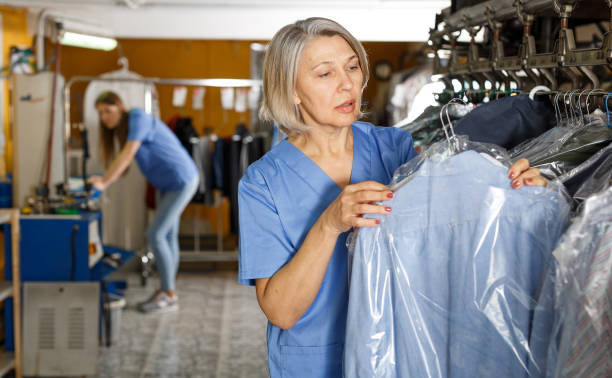 istock Portrait of cheerful female laundry worker 1130887193