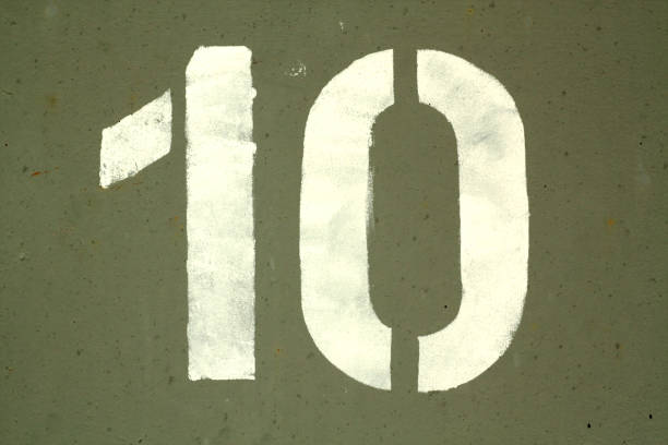 istock Number 10 in stencil on grey metal wall. 1130888213