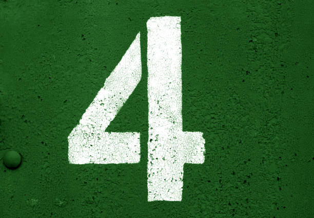 istock Number 4 in stencil on metal wall in green tone. 1130888257