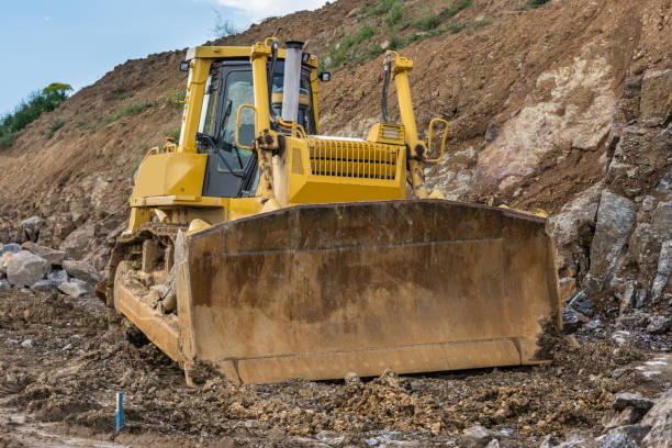 istock Excavator in a quarry moving stone 1130888890