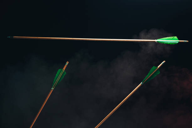 istock Three wood arrow one flying . Beautiful  smog background. Medieval weapons are handmade. 1130889195