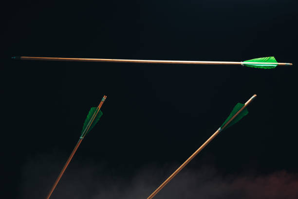 istock Three wood arrow one flying . Beautiful  smog background. Medieval weapons are handmade. 1130889228