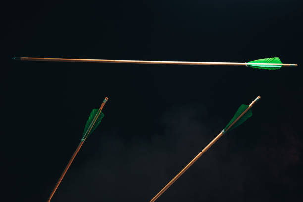 istock Three wood arrow one flying . Beautiful  smog background. Medieval weapons are handmade. 1130889310