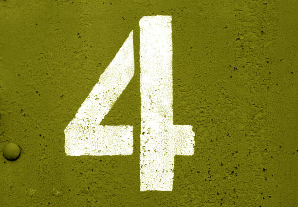 istock Number 4 in stencil on metal wall in yellow tone. 1130889435