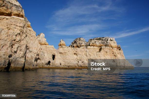 Cliff Located In Portugal Seen From The Sea Stock Photo - Download Image Now - Algarve, Atlantic Ocean, Blue