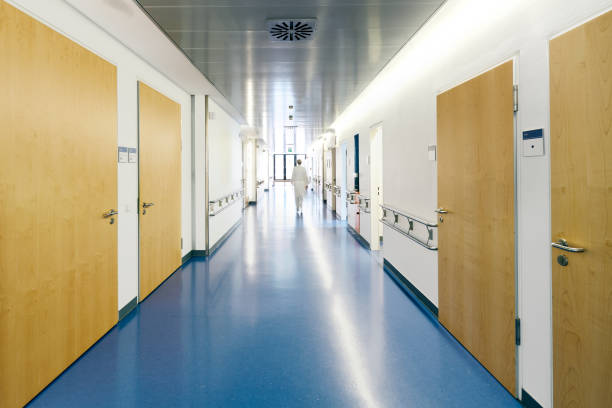 istock hospital doctor running blurred from behind 1130892241