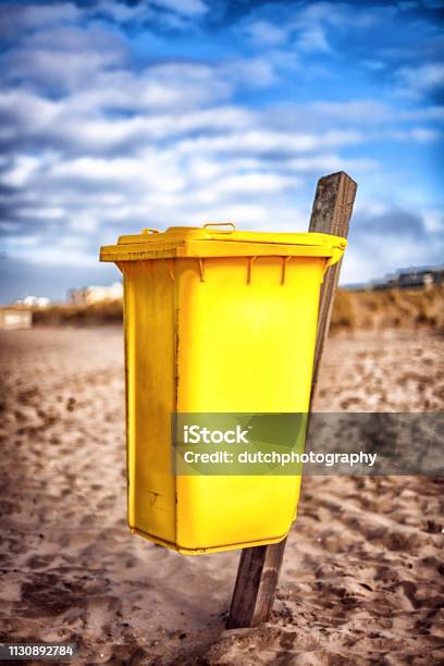 Yellow Waste Container On The Beach Stock Photo - Download Image Now - Beach, Cirrocumulus, Clean