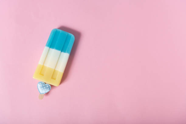 istock colorful an ice cream on pink pastel background. Summer minimal creative idea. 1130892838