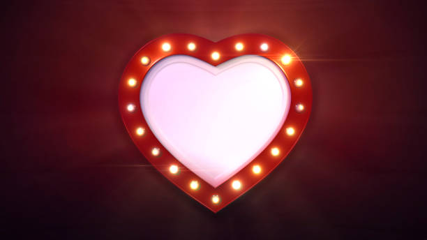istock red heart shape border with shiny light bulbs on dark background 1130897898