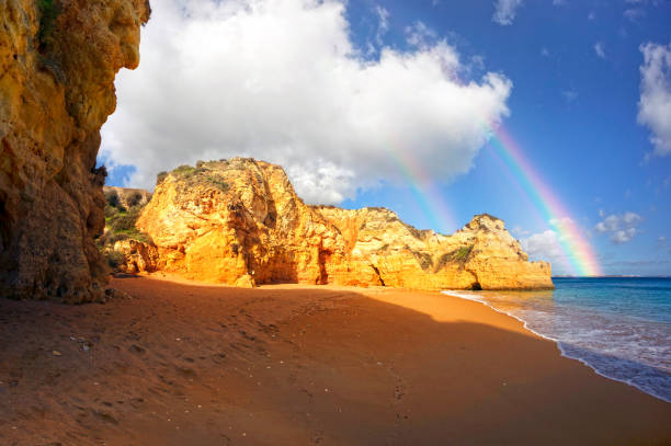 Rocky coast of Lagos, Portugal Famous beaches, cliffs and the sea in Lagos, Portugal attract many tourists and vacationers in the summer, and almost deserted in the winter, even though it is warm there benagil photos stock pictures, royalty-free photos & images