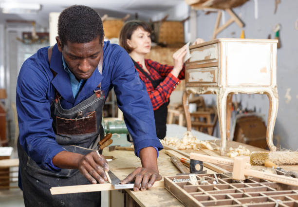 istock Woman and man carpenters 1130900844