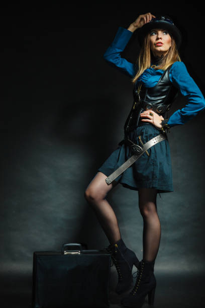 istock Steampunk girl with retro bag. 1130901555