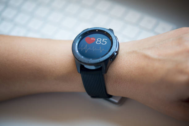 istock Smart watch at woman’s hand checking heart rate at the office 1130901627