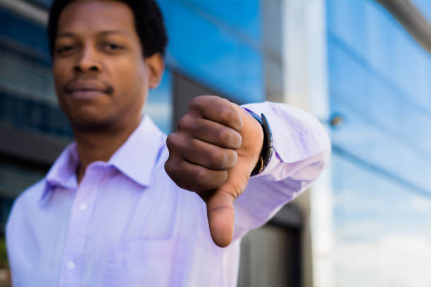 istock Young businessman showing thumb down. 1130903004