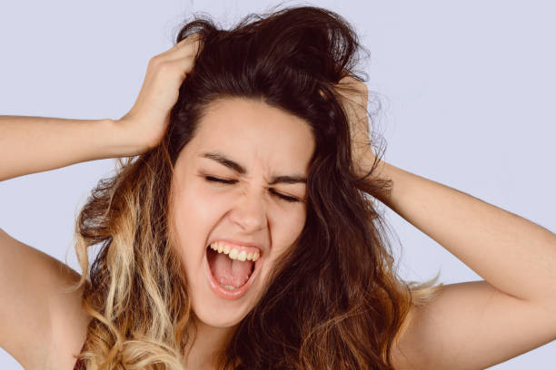 istock Young beautiful woman screaming. 1130903060