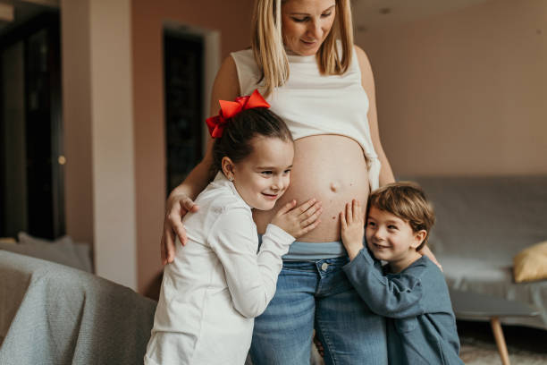 Kids and mom expecting a new baby
