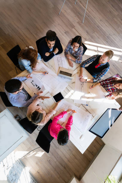 istock Business people and architects collaborating on project 1130905470