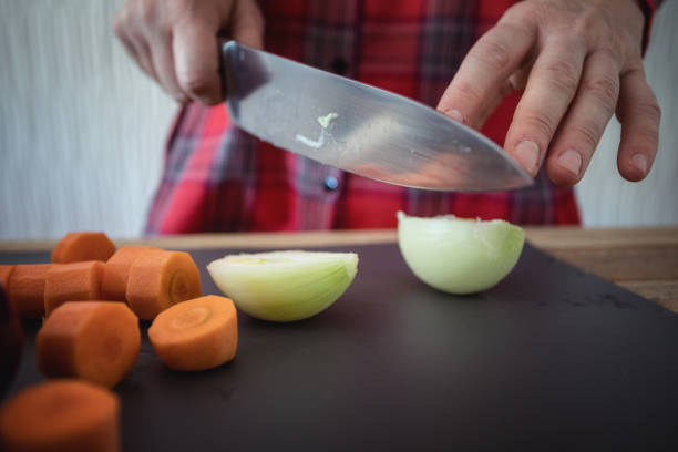 istock Cooking at home, vegetable soup preparing, chopping veggies, close-up 1130905819