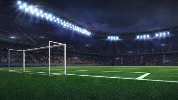 istock modern football stadium illuminated by spotlights and empty green grass 1130905925