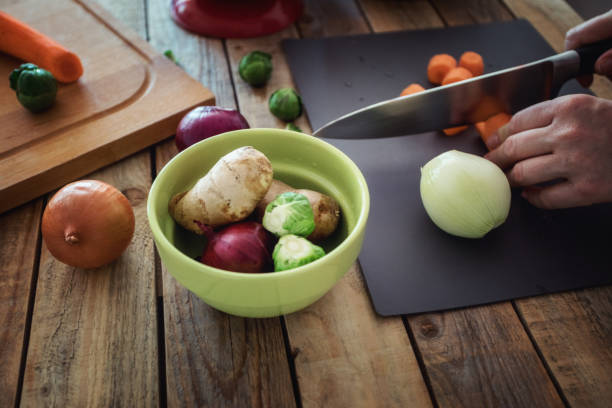 istock Cooking at home, vegetable soup preparing, chopping veggies 1130905943