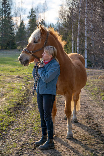 istock Horse and woman 1130907210