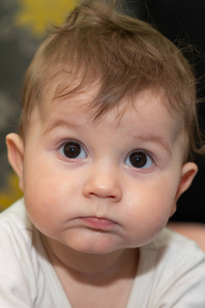 istock Baby boy is lying on tummy and looking at the camera. 1130907320