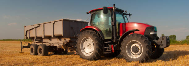 istock Tractor with trailer on the agricultural field 1130910227