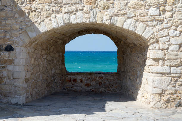 istock Old stone window from the fortress. 1130912029