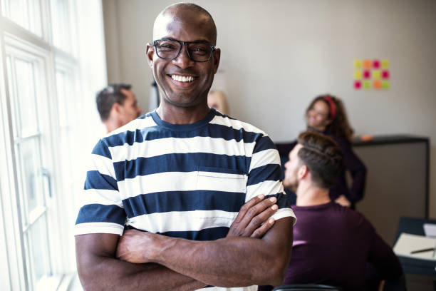 istock African designer smiling confidently after an office meeting 1130913399
