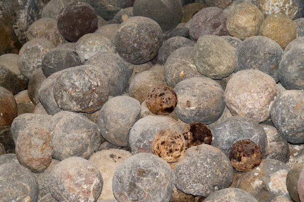 istock Old cannonballs in the stone fortress. 1130913779