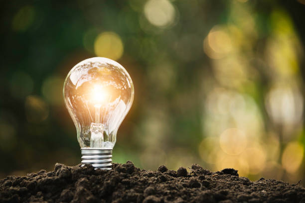 istock Light bulb putting on the soil in nature background. 1130917718