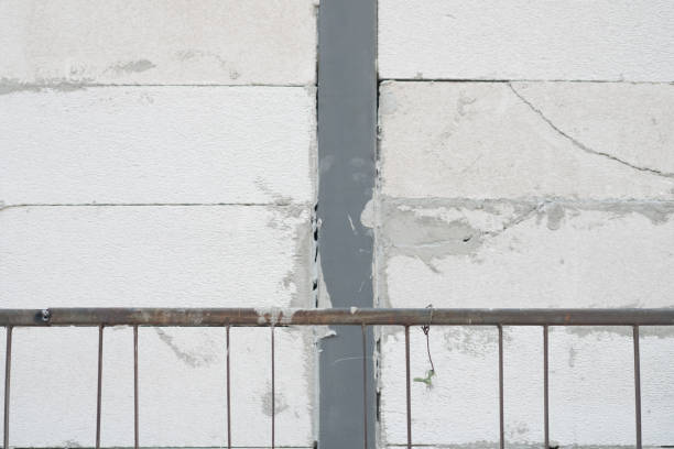istock Construction renovation exterior walls and installing stone with mortar 1130918581
