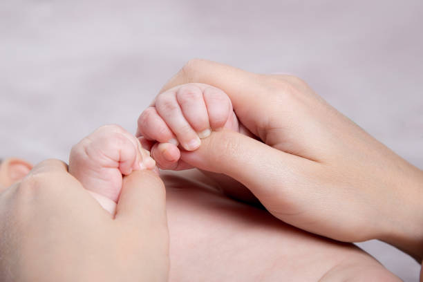 istock Baby hands in mother's hands 1130920405