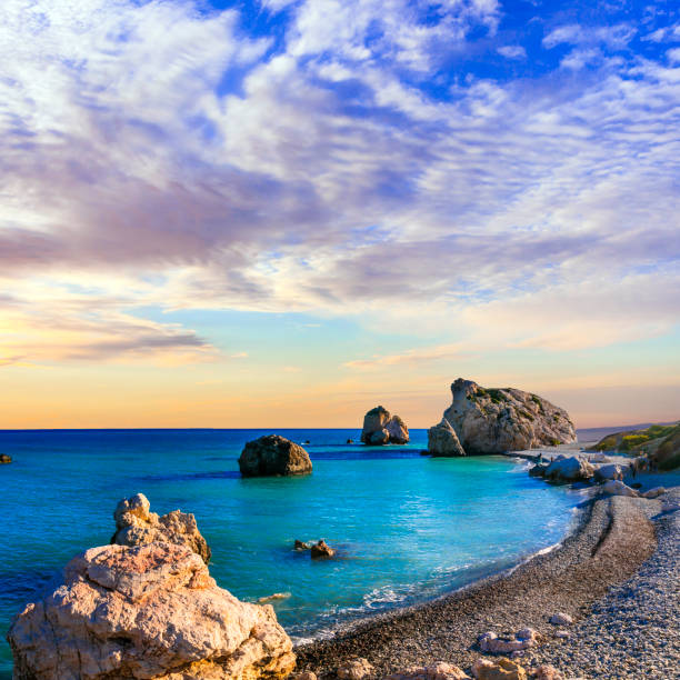 Best beaches of Cyprus - Petra tou Romiou, famous as a birthplace of Aphrodite beautiful romantic beach of Cyprus over sunset republic of cyprus photos stock pictures, royalty-free photos & images