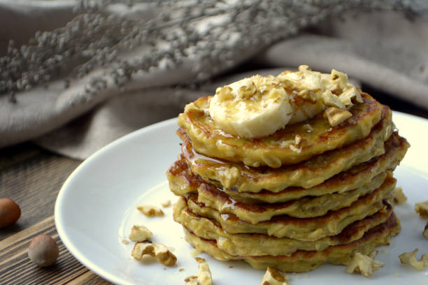 istock Stack of oatmeal pancake with banana, nuts and honey Healthy Breakfast 1130922473