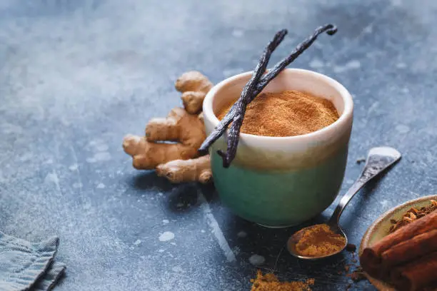 Vanilla chai tea latte in cup, ingredients. Macro, selective focus