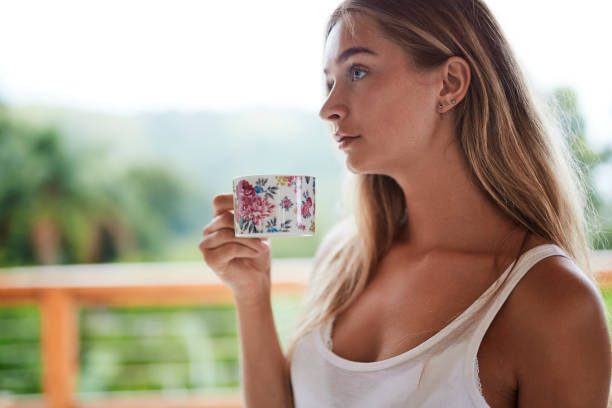 istock Thoughtful girl with tea 1130928184