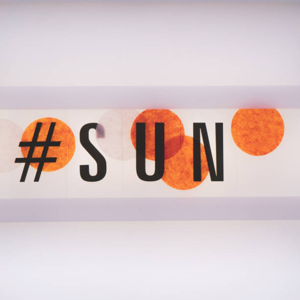 istock Black sun lettering with orange circles. Creative typography. 1130928199