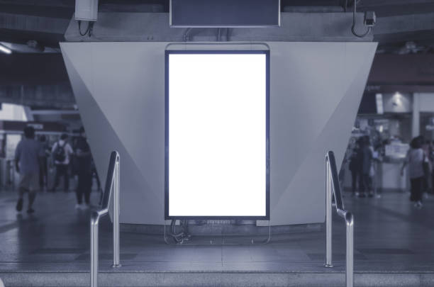 istock big blank billboard white LED screen vertical outstanding on bunting or concrete pillar side pathway walking to skytrain outdoor for display advertisement text template promotion new brand. 1130930116