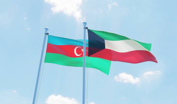 istock Kuwait and Azerbaijan, two flags waving against blue sky 1130932358