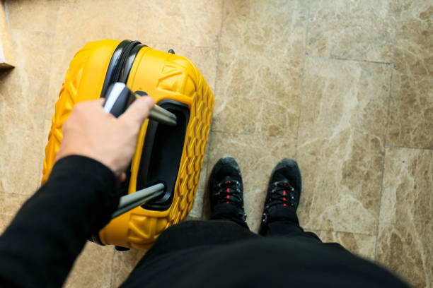 istock Personal persfective view of man holding suitcase's handle 1130933660