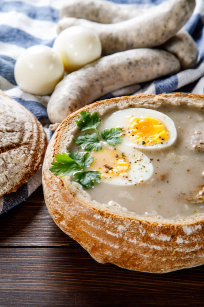 istock Sour rye soup in bread on wooden table 1130934010