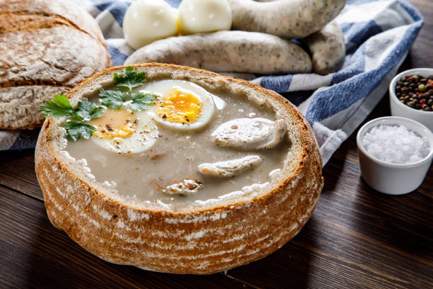 istock Sour rye soup in bread on wooden table 1130934433