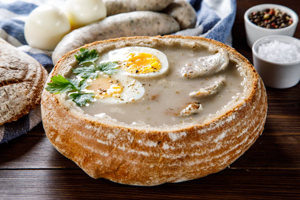 istock Sour rye soup in bread on wooden table 1130934473